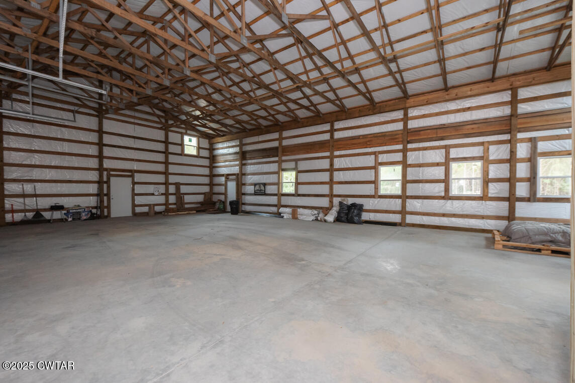 190 Pine Tree Drive Parsons, TN 38363 - Photo 9 of 56 a view of a room with wooden floor and furniture