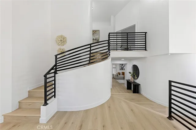 a living room with furniture and painting on the wall