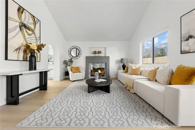 a spacious bedroom with a bed and a couch