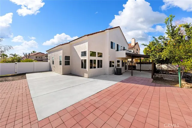 a swimming pool with outdoor seating