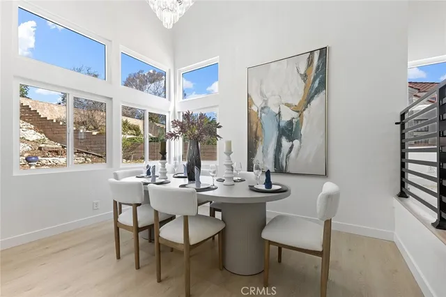 a view of a dining room with furniture and window