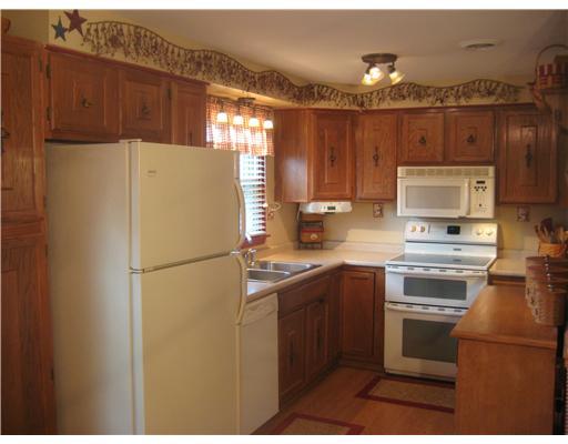 416 Nike Road Coraopolis, PA 15108 - Photo 3 of 18 Kitchen. Kitchen includes electric stove with double oven, refrigerator, dishwasher, built-in microwave. Laminate flooring, blinds and window treatments.