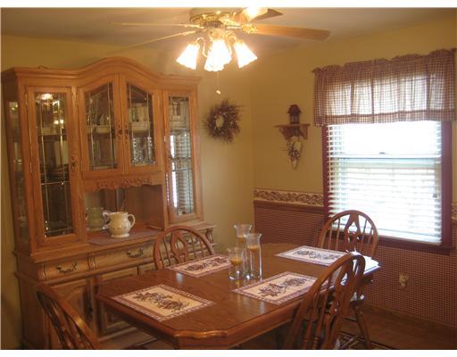 416 Nike Road Coraopolis, PA 15108 - Photo 4 of 18 Kitchen. Dining area off the kitchen also has laminate flooring. Chair rail, window treatments, blinds and ceiling fan light fixture included. Area rug matches the wall border and is also included.
