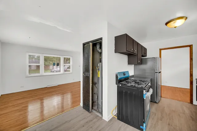 a kitchen with stainless steel appliances granite countertop a refrigerator stove and oven