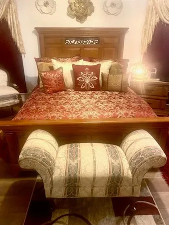 a bedroom with a bed and a cabinets