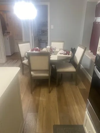 a balcony with chairs and a table