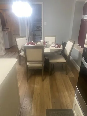 a balcony with chairs and a table