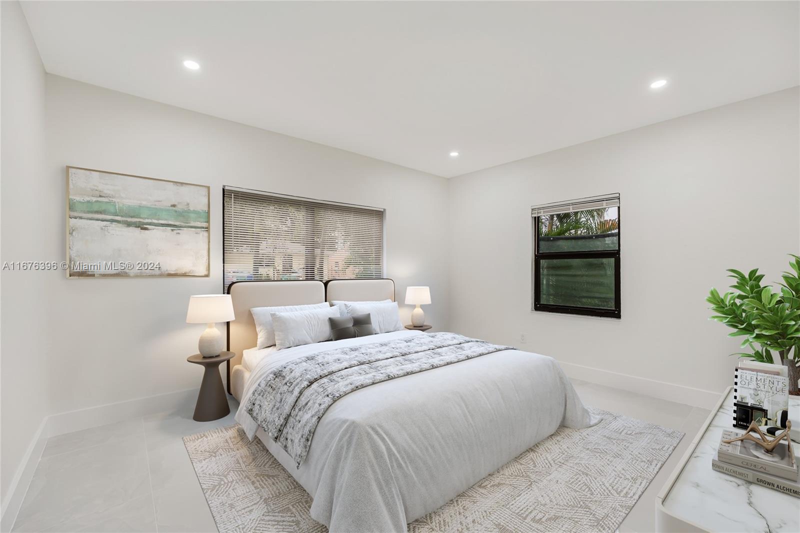 1740 Northwest 53rd Street Miami, FL 33142 - Photo 15 of 25 a bedroom with a bed and a window