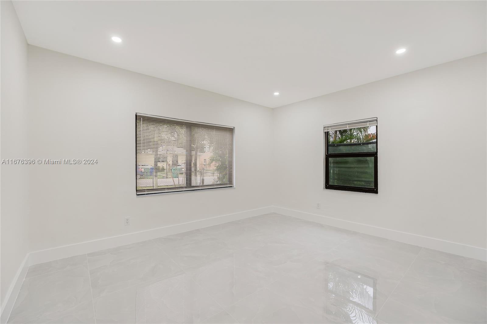 1740 Northwest 53rd Street Miami, FL 33142 - Photo 16 of 25 a view of an empty room with a window