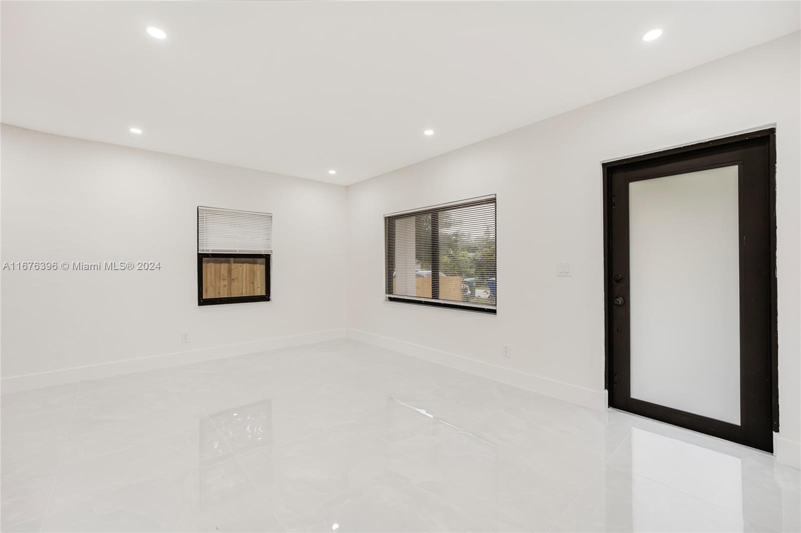 1740 Northwest 53rd Street Miami, FL 33142 - Photo 20 of 25 a view of a livingroom with an entryway