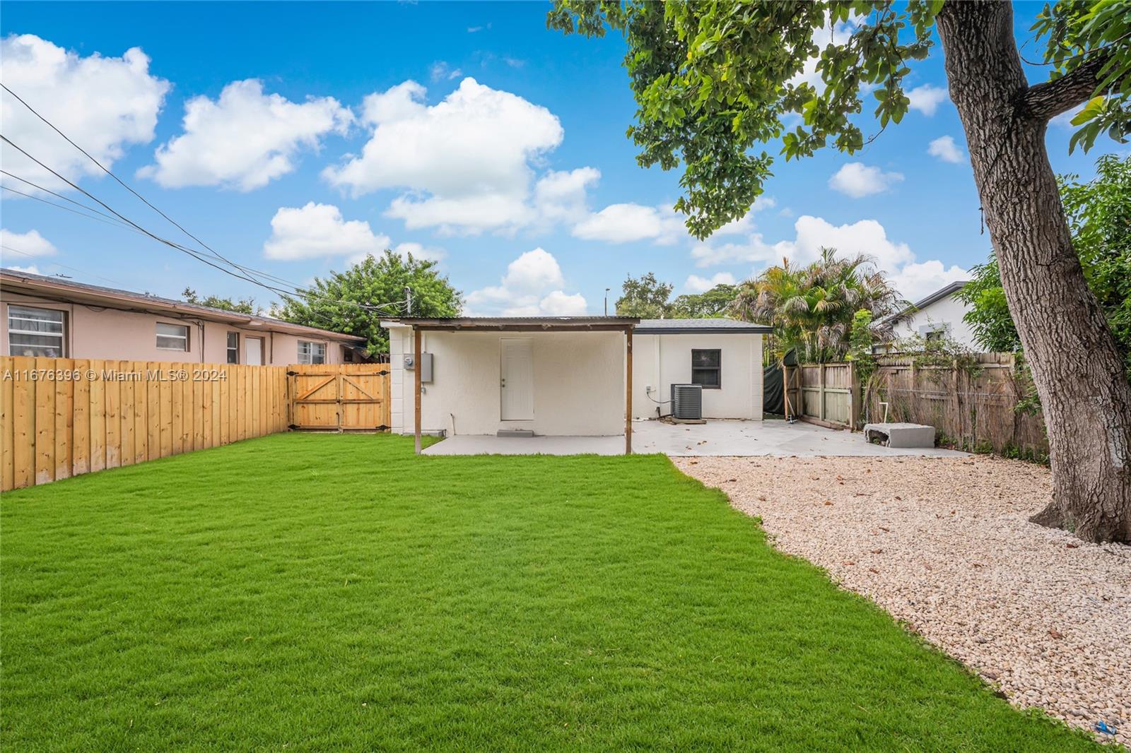 1740 Northwest 53rd Street Miami, FL 33142 - Photo 24 of 25 front view of a house with a yard