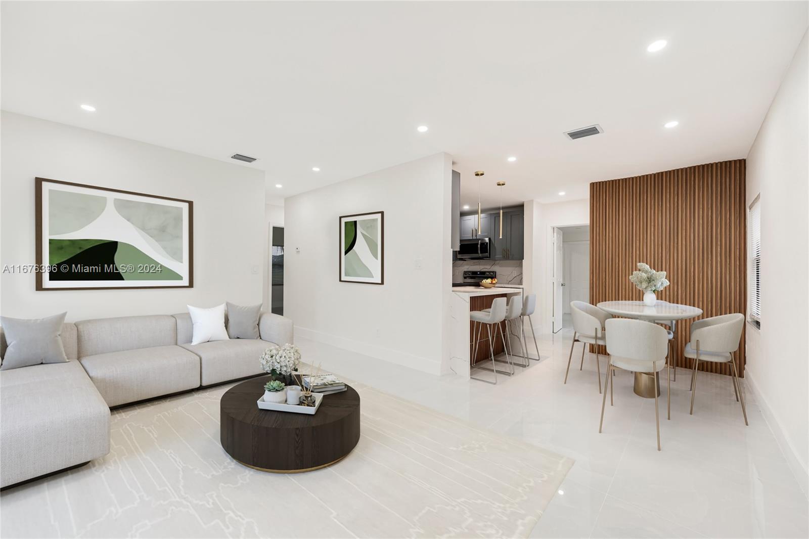 1740 Northwest 53rd Street Miami, FL 33142 - Photo 3 of 25 a living room with furniture and a flat screen tv
