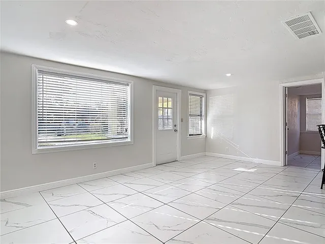 a view of an empty room and window