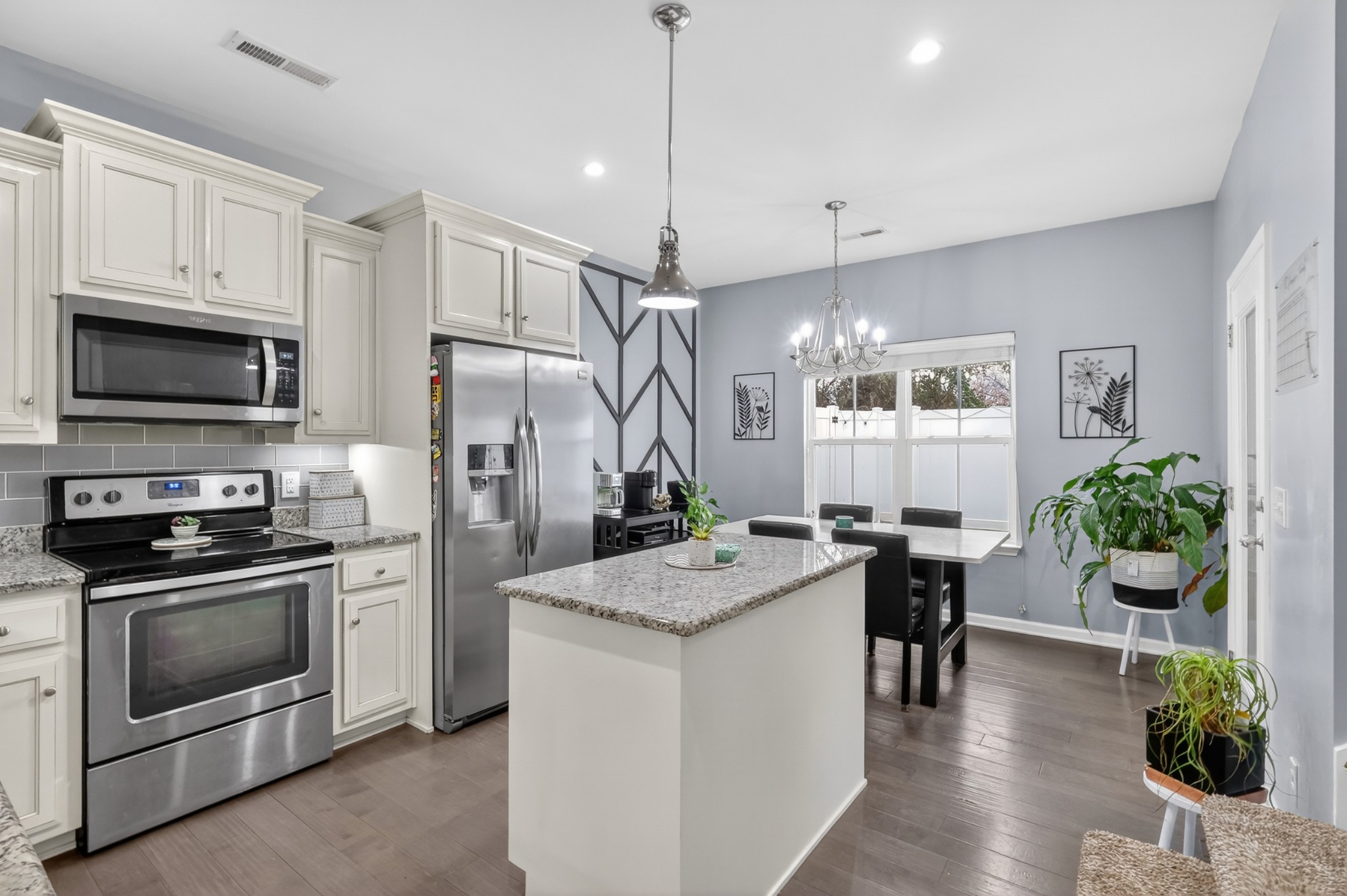 706 Indian Ridge Circle White House, TN 37188 - Photo 13 of 42 a kitchen with granite countertop a stove a sink and a refrigerator