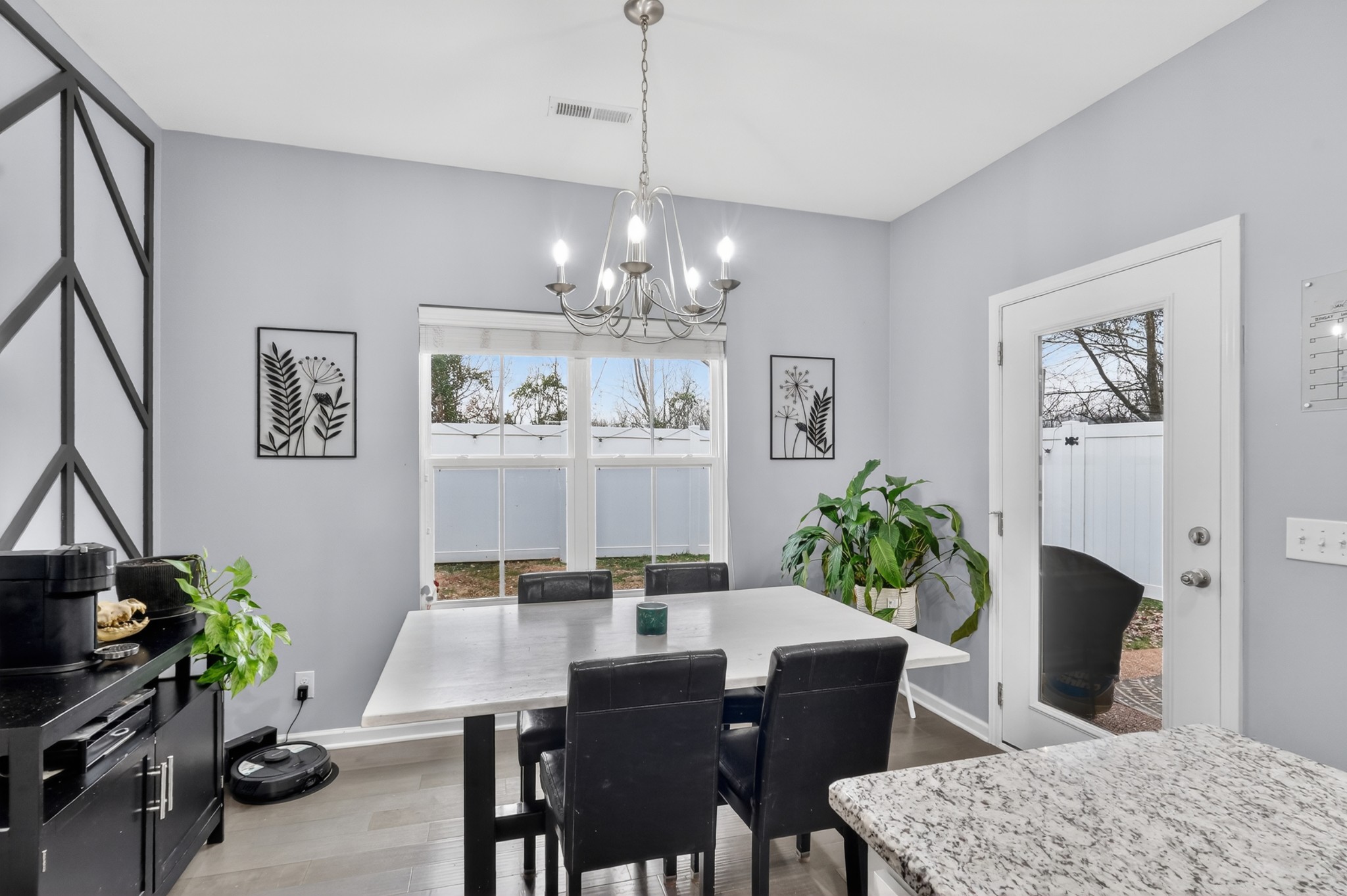 706 Indian Ridge Circle White House, TN 37188 - Photo 18 of 42 a dining room with furniture a kitchen and a chandelier