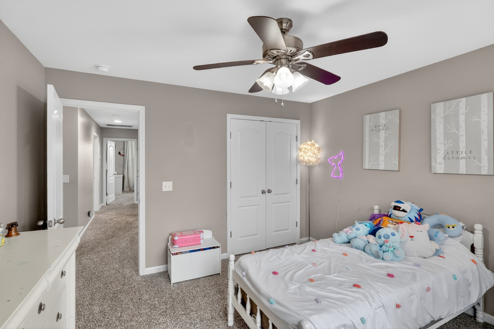 706 Indian Ridge Circle White House, TN 37188 - Photo 30 of 42 a bedroom with a bed and a chandelier