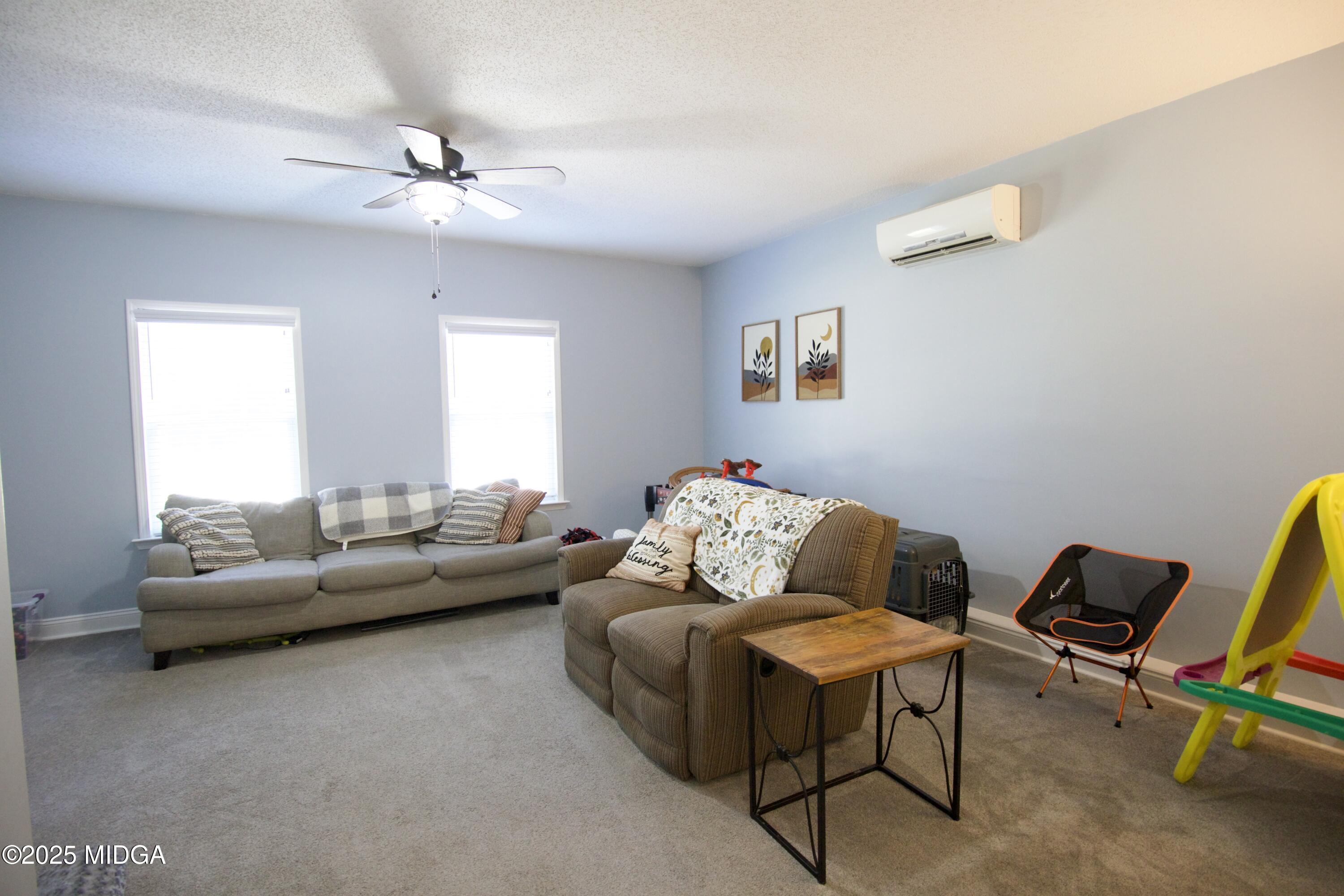 1205 Morningside Drive Perry, GA 31069 - Photo 12 of 31 a living room with furniture and a window