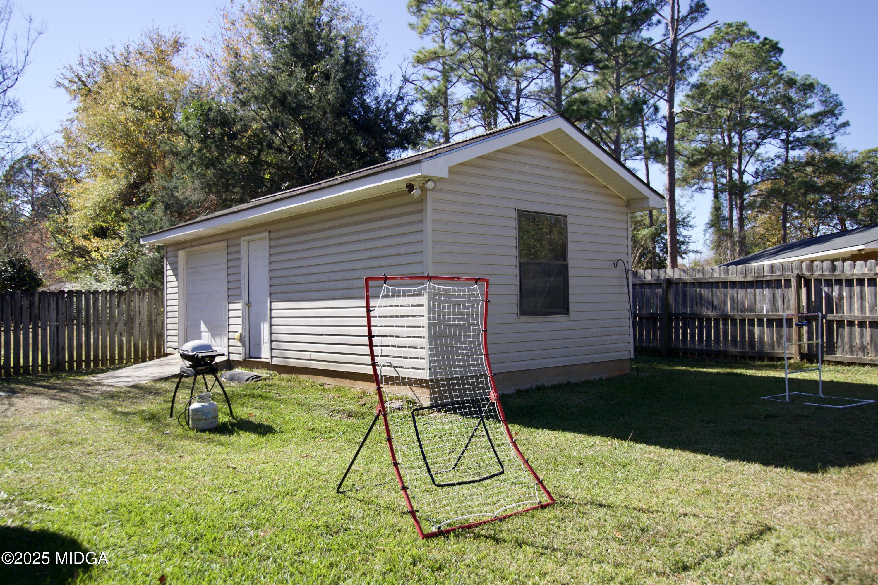 1205 Morningside Drive Perry, GA 31069 - Photo 24 of 31 a backyard of a house with table and chairs