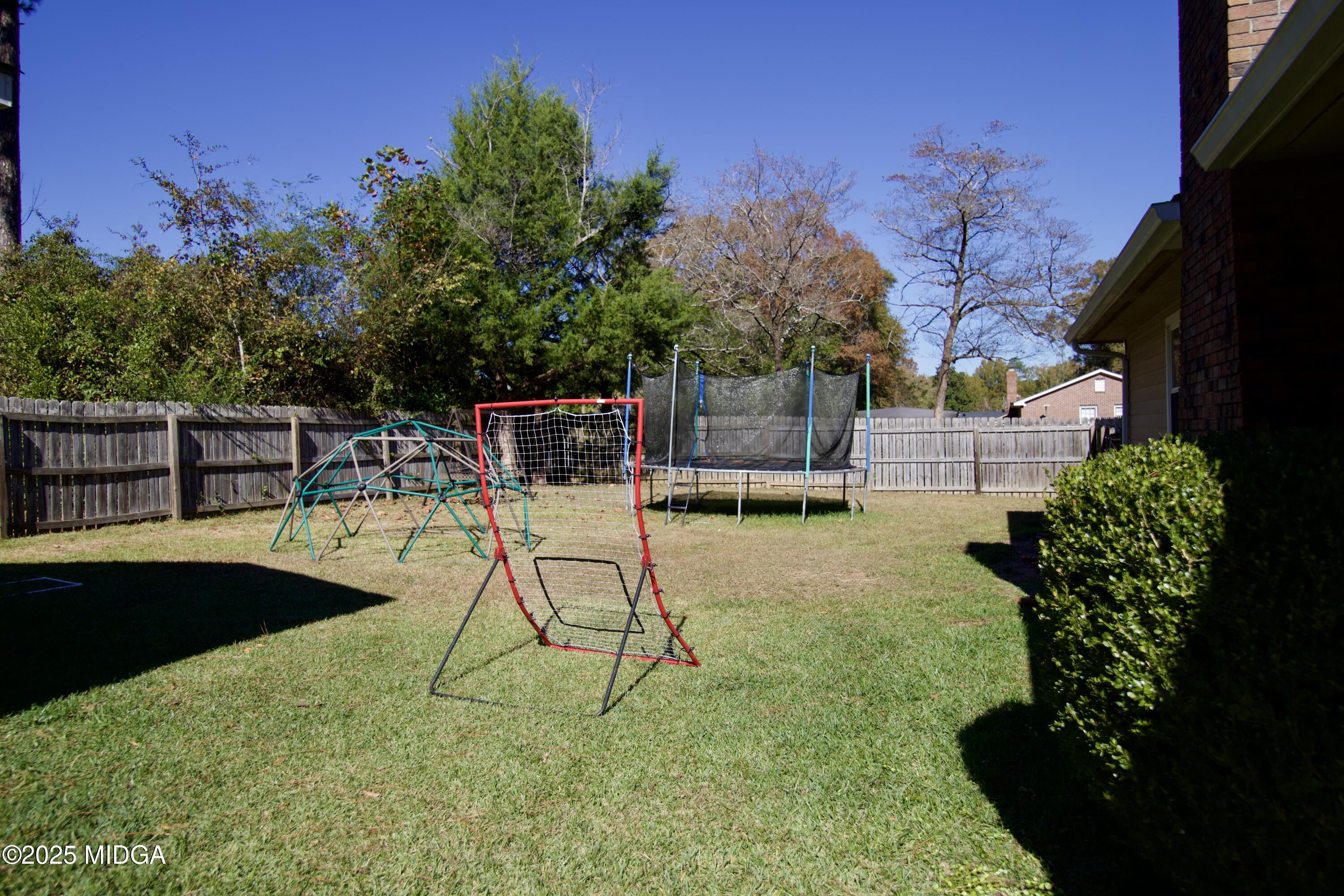 1205 Morningside Drive Perry, GA 31069 - Photo 25 of 31 a view of a swimming pool with a lounge chair