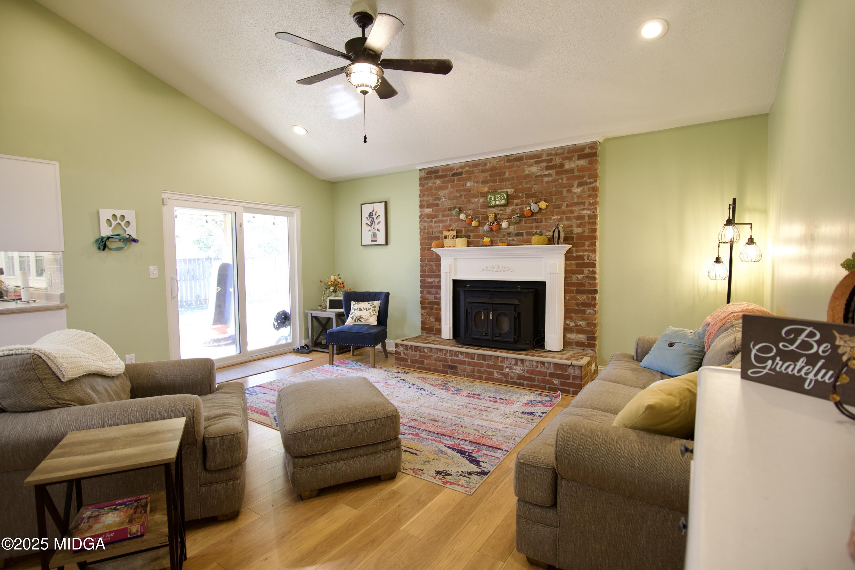1205 Morningside Drive Perry, GA 31069 - Photo 5 of 31 a living room with furniture fireplace and a window