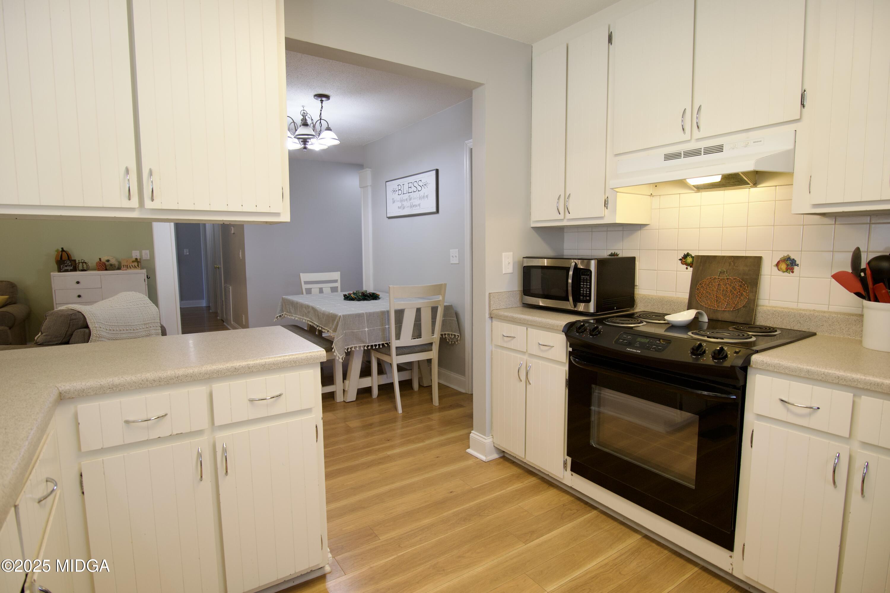 1205 Morningside Drive Perry, GA 31069 - Photo 6 of 31 a kitchen with cabinets and appliances
