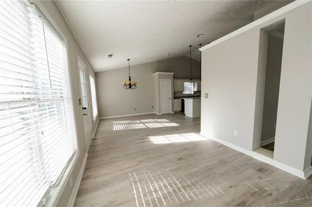 a view of a big room with a kitchen