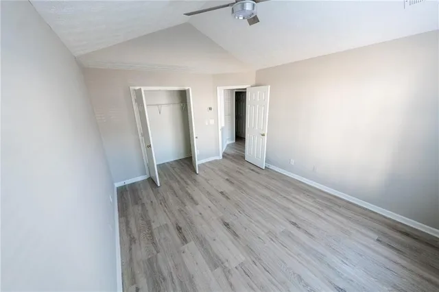 an empty room with wooden floor
