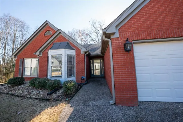 a front view of a house with garden