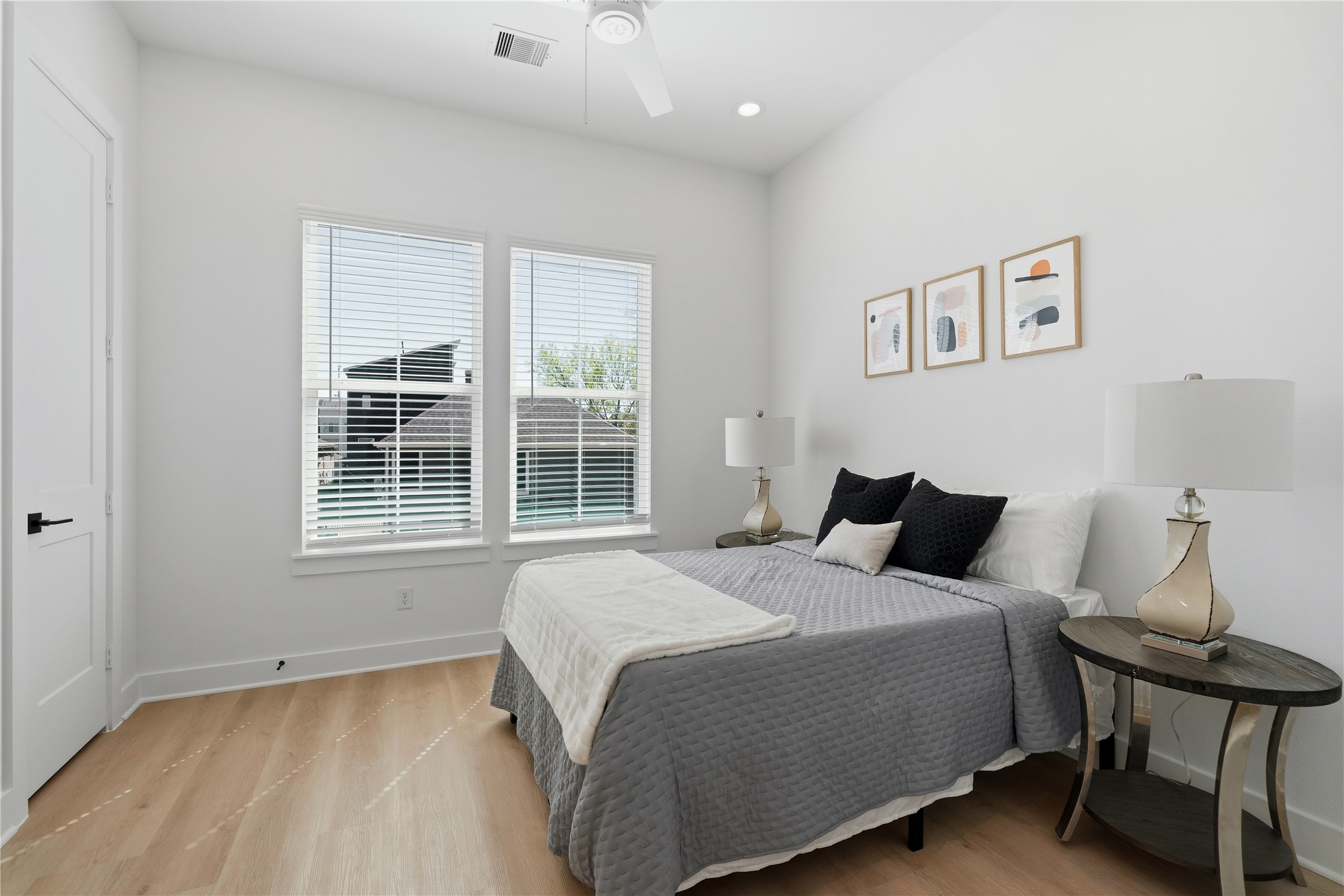 4610 Gunter Street Houston, TX 77020 - Photo 25 of 43 a bedroom with a bed and wooden floor