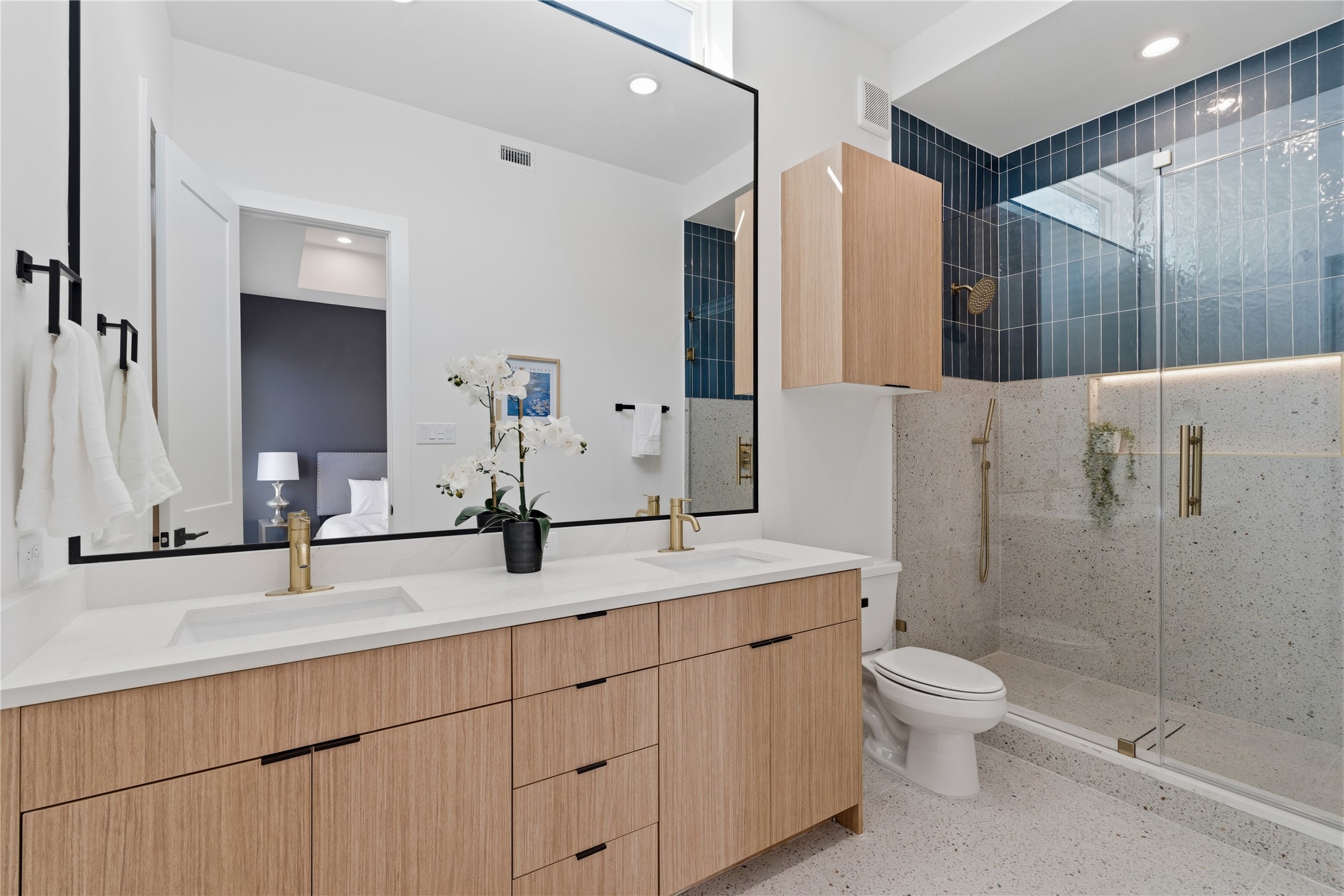 4610 Gunter Street Houston, TX 77020 - Photo 35 of 43 a bathroom with double vanity sink a mirror and a shower