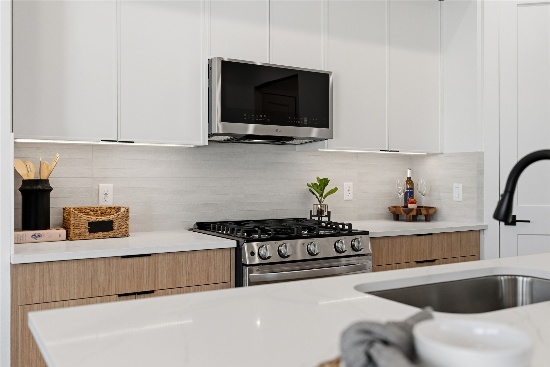 4610 Gunter Street Houston, TX 77020 - Photo 8 of 43 a kitchen with stainless steel appliances a stove a sink and a microwave