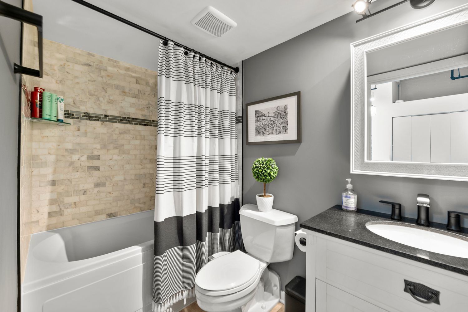 500 South Clinton Street, Unit 624 Chicago, IL 60607 - Photo 15 of 37 a bathroom with a granite countertop toilet sink and bathtub