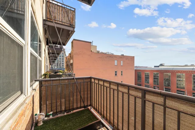 a view of a balcony with furniture