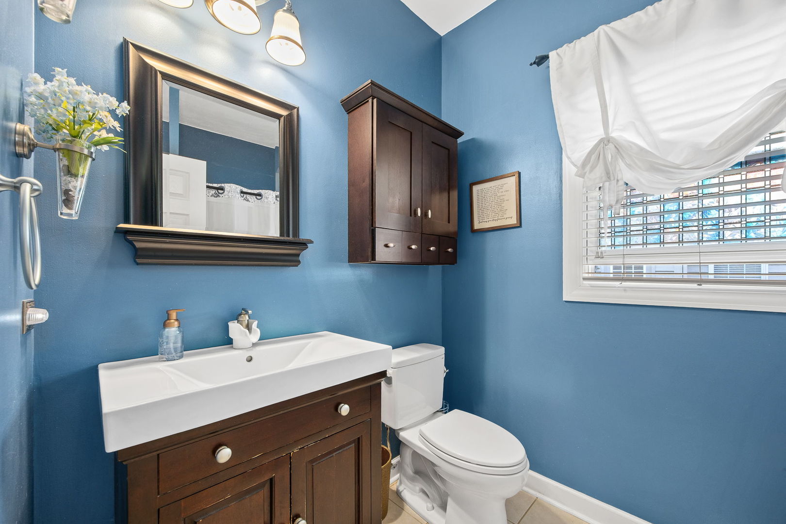 2816 Cordgrass Road Naperville, IL 60564 - Photo 20 of 49 a bathroom with a toilet sink and mirror