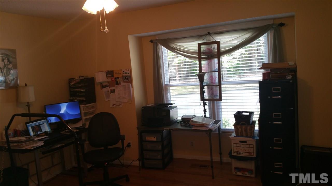 1420 Mapleside Court Raleigh, NC 27609 - Photo 14 of 25 a room with furniture and a chandelier