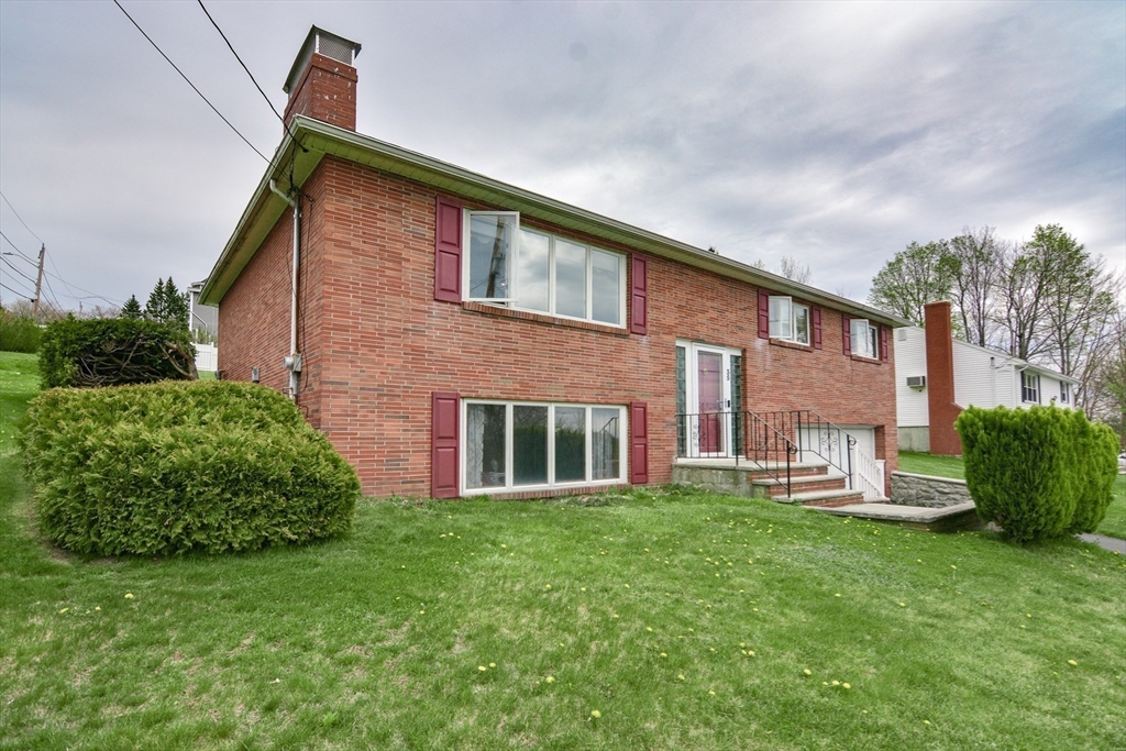 35 Worcester Street Methuen, MA 01844 - Photo 1 of 31 a view of a house with a yard and plants
