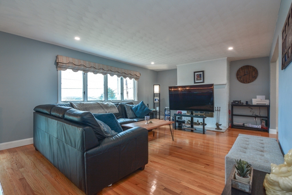 35 Worcester Street Methuen, MA 01844 - Photo 11 of 31 a living room with furniture and a flat screen tv