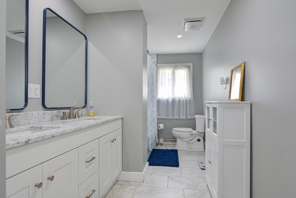 35 Worcester Street Methuen, MA 01844 - Photo 13 of 31 a spacious bathroom with a double vanity sink and a mirror