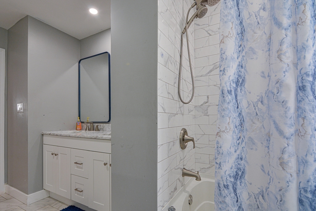 35 Worcester Street Methuen, MA 01844 - Photo 14 of 31 a bathroom with a sink vanity and a mirror