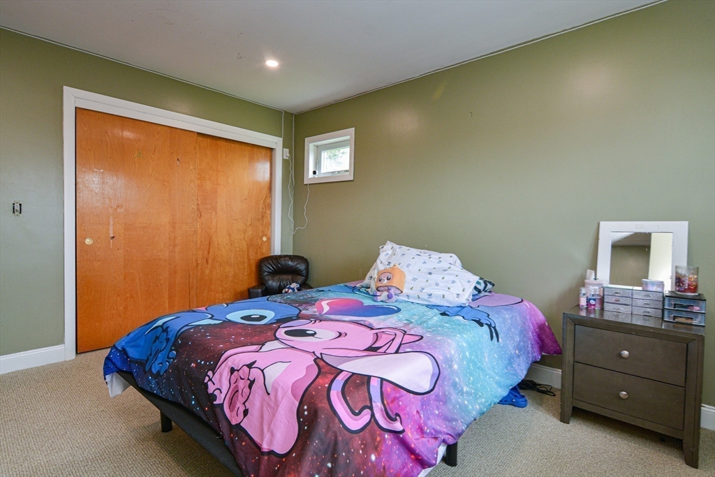 35 Worcester Street Methuen, MA 01844 - Photo 21 of 31 a bedroom with a bed and a window