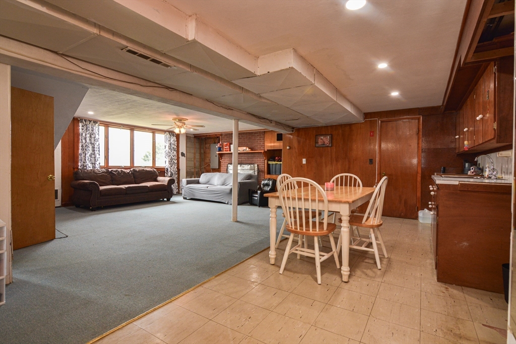 35 Worcester Street Methuen, MA 01844 - Photo 23 of 31 a view of a dining room with furniture and a chandelier