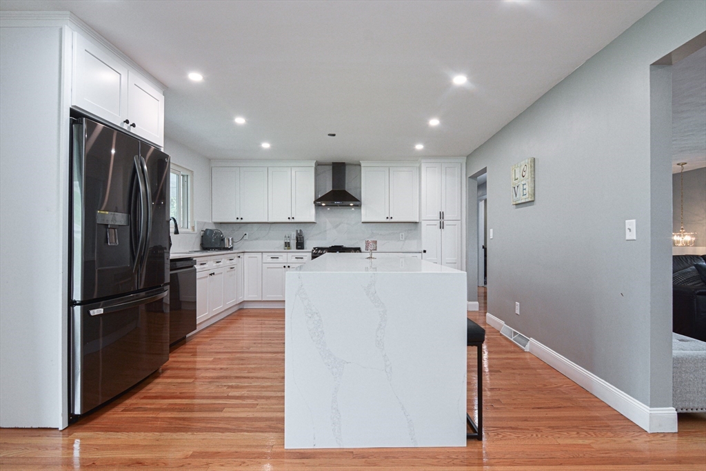 35 Worcester Street Methuen, MA 01844 - Photo 7 of 31 a kitchen with stainless steel appliances granite countertop a refrigerator and a stove top oven