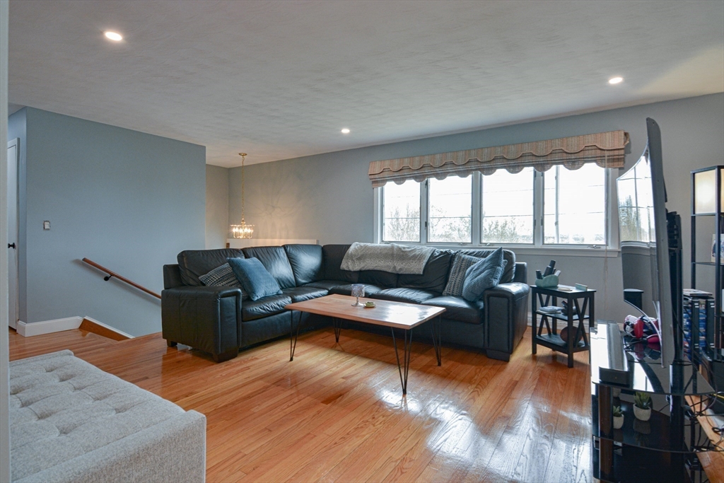 35 Worcester Street Methuen, MA 01844 - Photo 10 of 31 a living room with furniture and a wooden floor