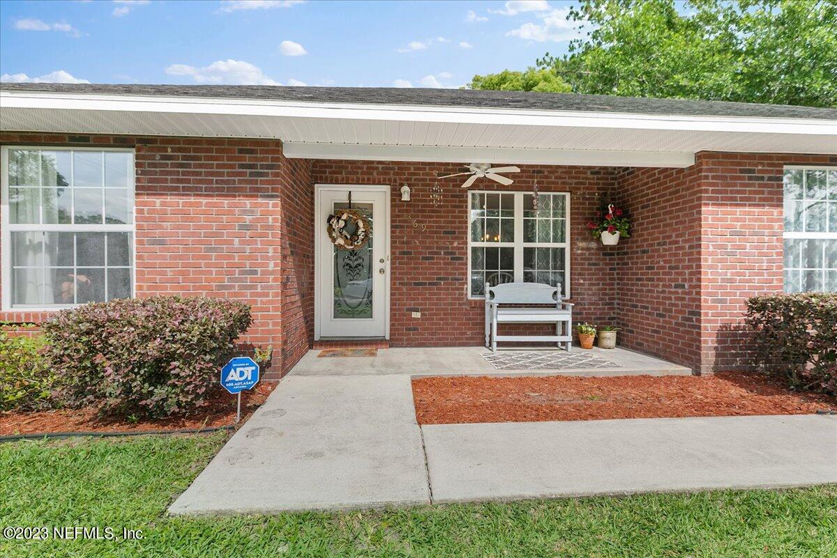369 Owen Acres Drive Macclenny, FL 32063 - Photo 1 of 21 a front view of a house with a yard