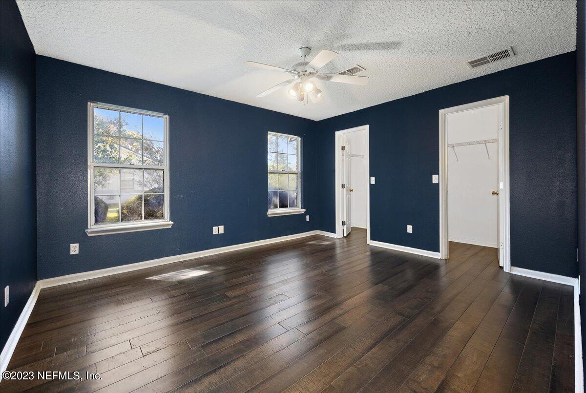 369 Owen Acres Drive Macclenny, FL 32063 - Photo 11 of 21 a view of an empty room with wooden floor and a window