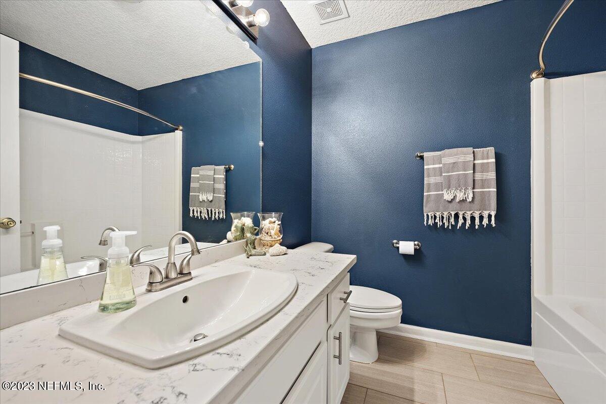 369 Owen Acres Drive Macclenny, FL 32063 - Photo 16 of 21 a bathroom with a sink toilet and mirror