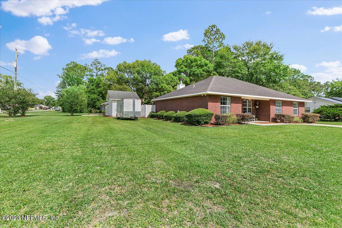 369 Owen Acres Drive Macclenny, FL 32063 - Photo 18 of 21 a house view with a garden space