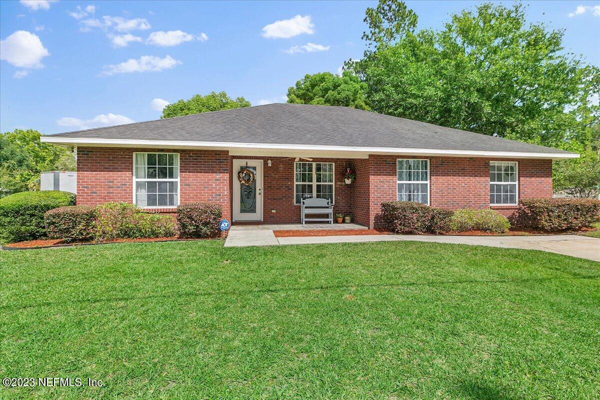 369 Owen Acres Drive Macclenny, FL 32063 - Photo 2 of 21 a front view of house with yard and green space