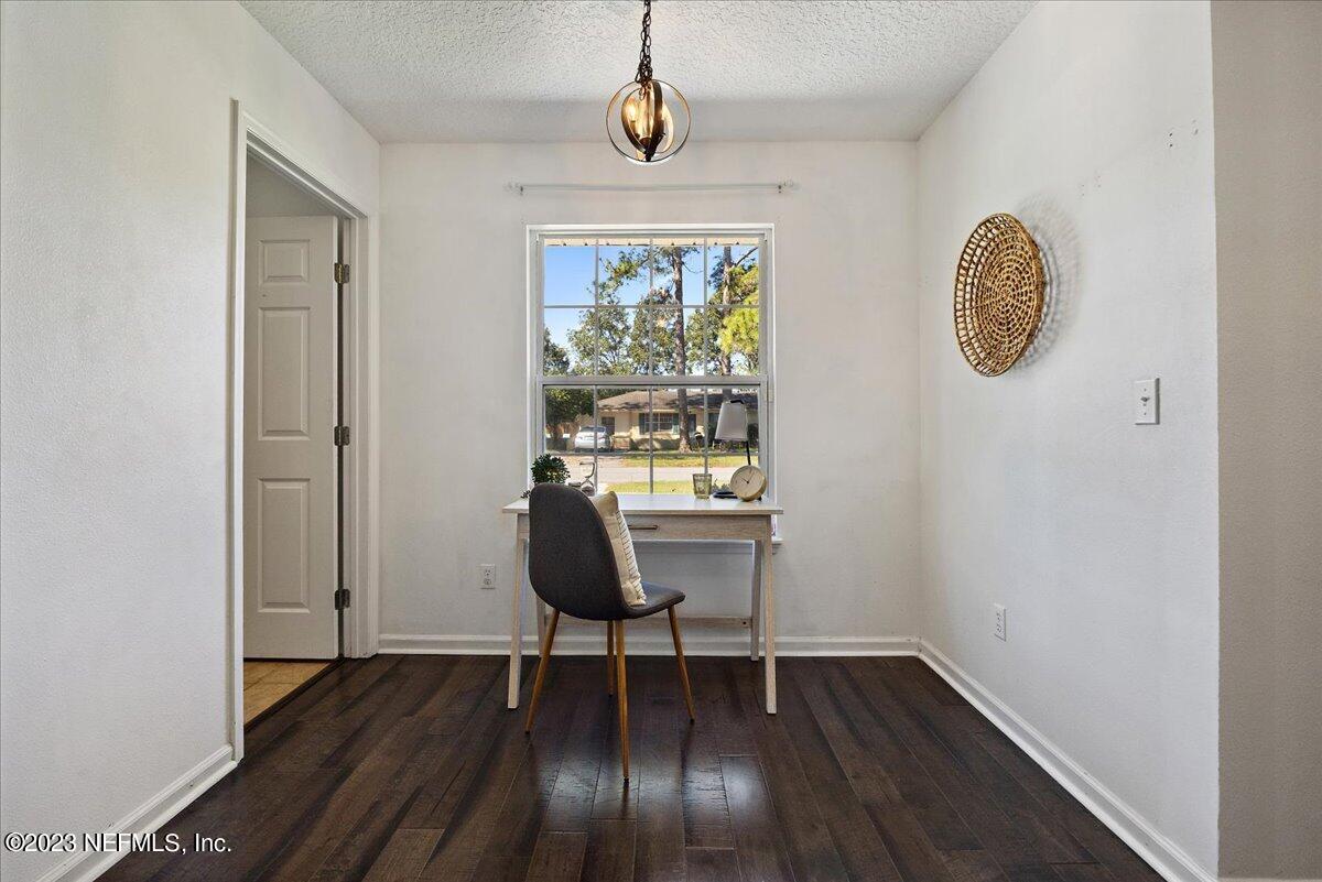 369 Owen Acres Drive Macclenny, FL 32063 - Photo 8 of 21 a view of a hallway with wooden floor and a window