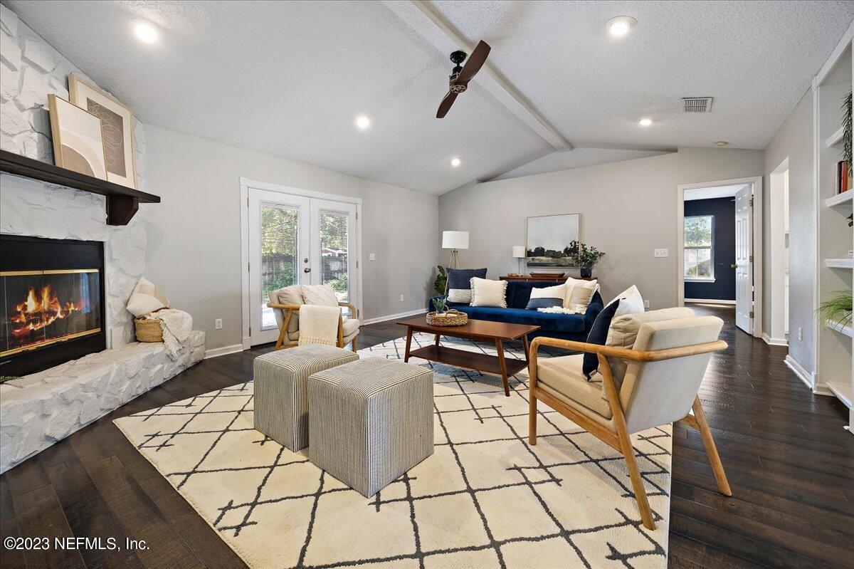 369 Owen Acres Drive Macclenny, FL 32063 - Photo 10 of 21 a living room with fireplace furniture and a wooden floor